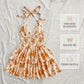 👗🌸 LIMITED-TIME 50% OFF! Women’s Halter Tie-Neck Printed Mini Dress – Lace-Up Front, Smocked Back & Tiered Ruffle Skirt ✨